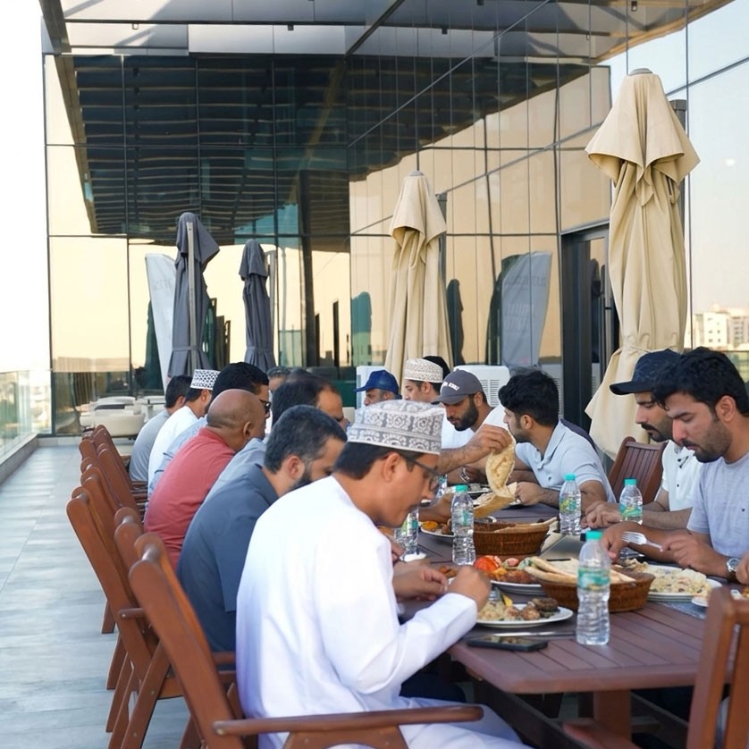 Guests sharing a meal on the outdoor terrace at Kabul Palace